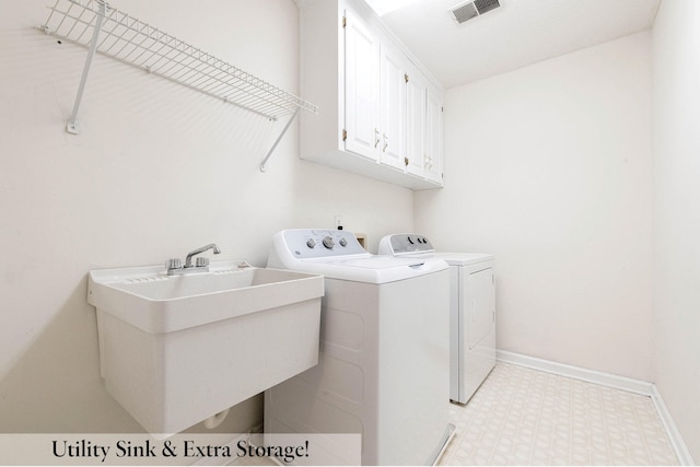 laundry room with cabinets, separate washer and dryer, and sink