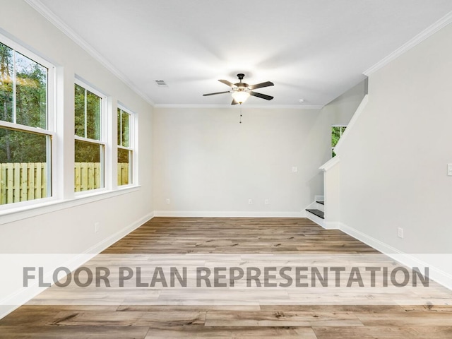 unfurnished room featuring baseboards, visible vents, stairway, wood finished floors, and crown molding