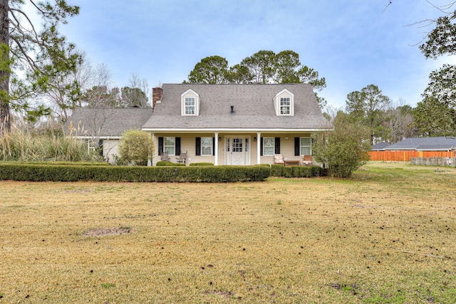 new england style home with a front yard