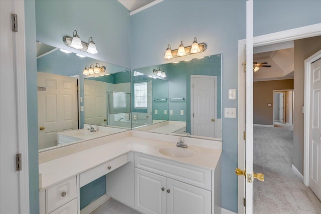 full bathroom featuring a stall shower, ceiling fan, and vanity