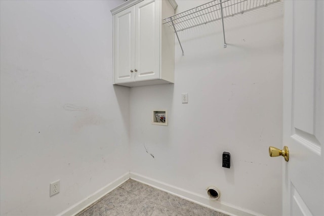 washroom featuring cabinet space, hookup for a washing machine, baseboards, and electric dryer hookup