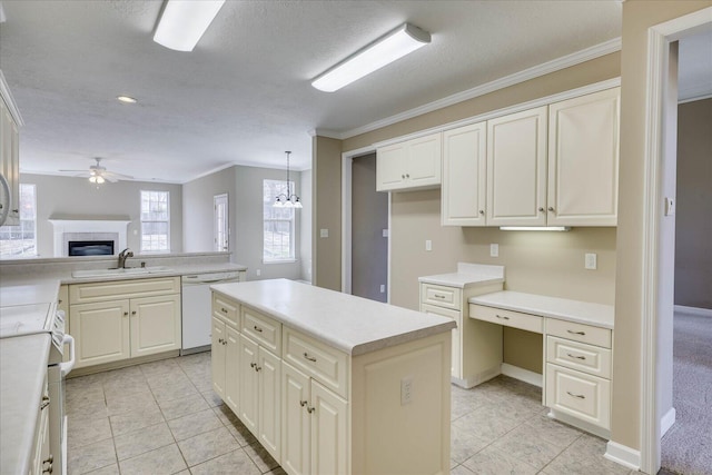 kitchen featuring light countertops, hanging light fixtures, open floor plan, a sink, and white appliances