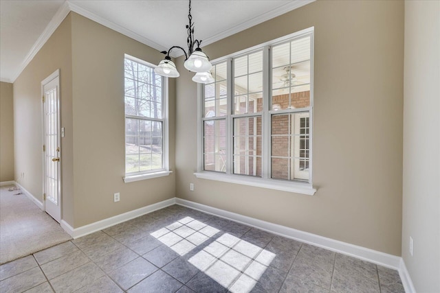 unfurnished dining area with ornamental molding, a wealth of natural light, and baseboards