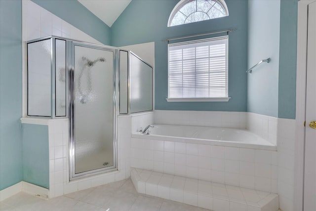 bathroom with lofted ceiling, tile patterned flooring, a shower stall, and a bath