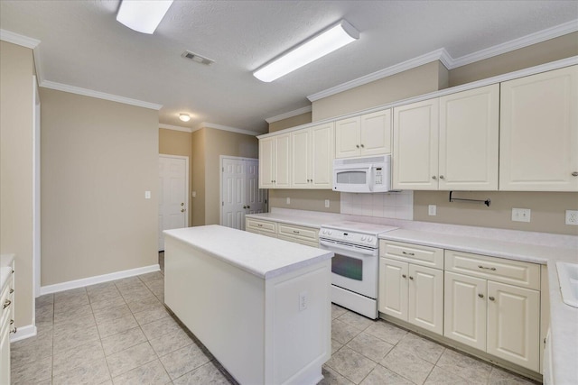 kitchen featuring a center island, crown molding, light countertops, white cabinets, and white appliances