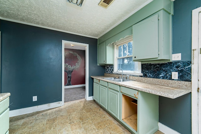 kitchen featuring backsplash and sink