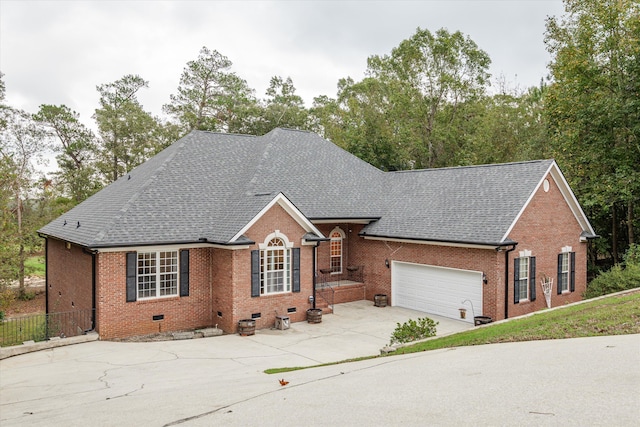 ranch-style home featuring a garage