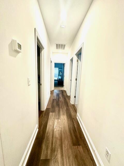 hallway featuring dark wood-type flooring