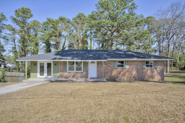 single story home featuring brick siding and french doors