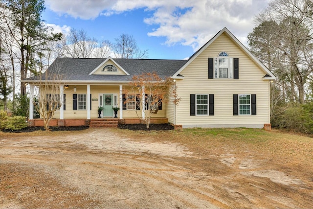 view of front of house featuring covered porch and crawl space