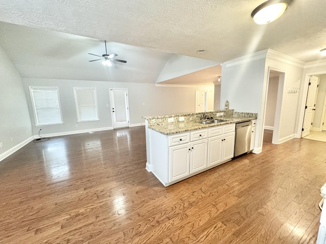 1026 Barrett Dr, Evans, GA 30809 - kitchen featuring stainless steel dishwasher, a textured ceiling, wood finished floors, a ceiling fan, and open floor plan