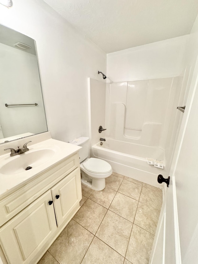 1026 Barrett Dr, Evans, GA 30809 - bathroom featuring vanity, tile patterned floors, shower / bathtub combination, and a textured ceiling