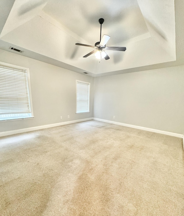 1026 Barrett Dr, Evans, GA 30809 - unfurnished room with a raised ceiling, carpet, and a ceiling fan