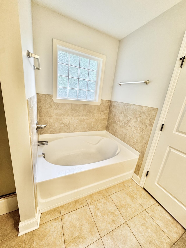 1026 Barrett Dr, Evans, GA 30809 - bathroom featuring a bath and tile patterned flooring
