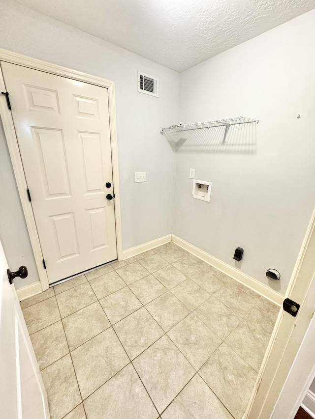 1026 Barrett Dr, Evans, GA 30809 - washroom with washer hookup, light tile patterned floors, and a textured ceiling
