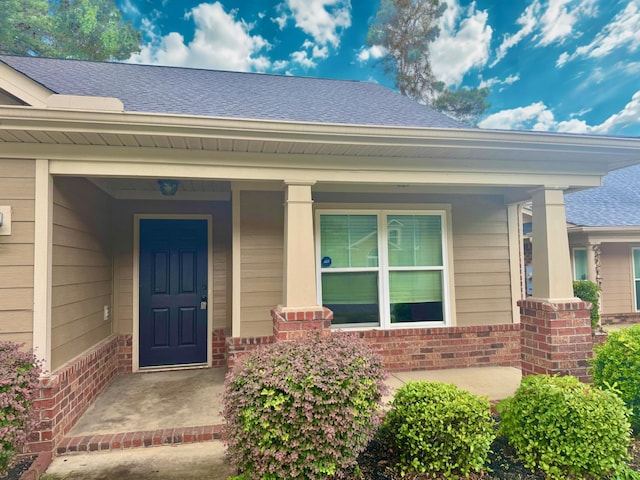 1026 Barrett Dr, Evans, GA 30809 - property entrance featuring brick siding, a shingled roof, and a porch