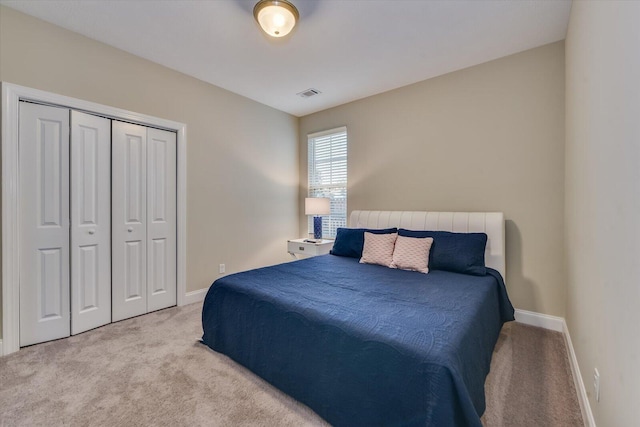 carpeted bedroom featuring a closet