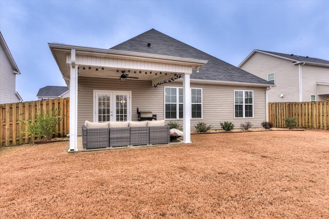 rear view of house with ceiling fan and outdoor lounge area