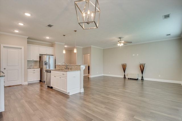 3109 Lobella Dr, Grovetown, GA 30813 - kitchen featuring appliances with stainless steel finishes, a sink, recessed lighting, light wood-style flooring, and open floor plan