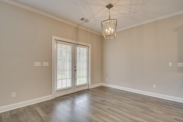 3109 Lobella Dr, Grovetown, GA 30813 - unfurnished room featuring a chandelier, wood finished floors, crown molding, baseboards, and french doors
