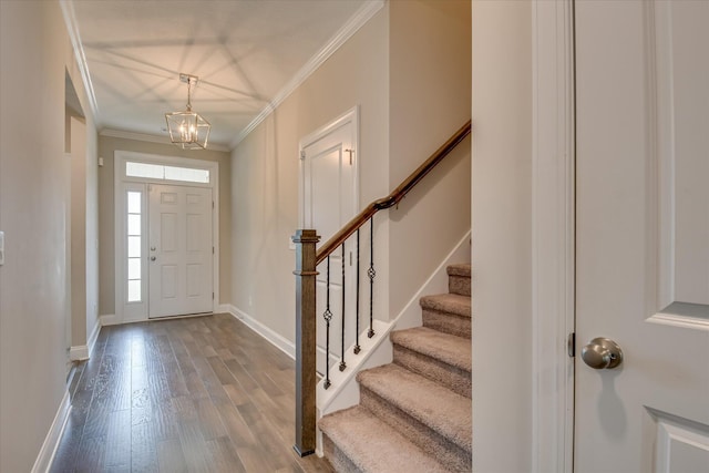 3109 Lobella Dr, Grovetown, GA 30813 - entrance foyer featuring a chandelier, stairs, baseboards, dark wood-type flooring, and crown molding