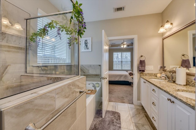 bathroom featuring vanity, a bath, and ceiling fan