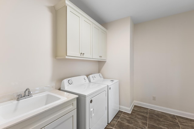 laundry room with cabinets, sink, and independent washer and dryer