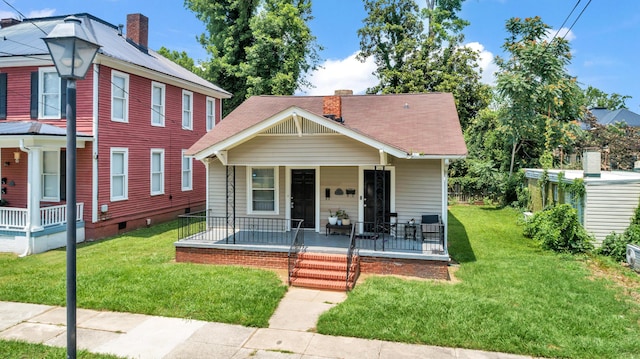 209 Ellis St, Augusta, GA 30901 - view of front of property with a porch, a chimney, and a front lawn