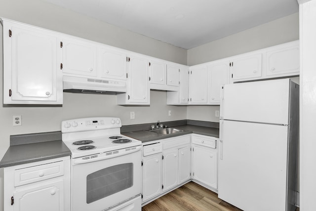 209 Ellis St, Augusta, GA 30901 - kitchen featuring white appliances, under cabinet range hood, dark countertops, and white cabinetry