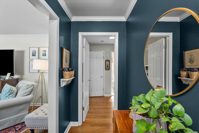 hall with crown molding and light wood-type flooring