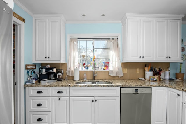 kitchen with sink, white cabinets, and appliances with stainless steel finishes