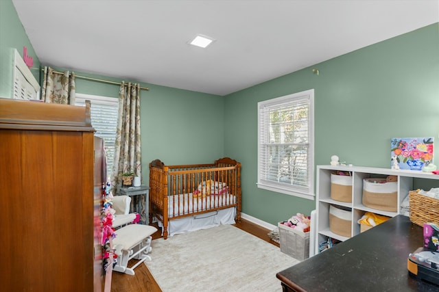 bedroom with hardwood / wood-style flooring