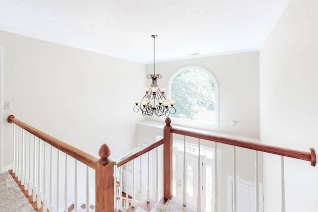 interior details featuring crown molding and a notable chandelier
