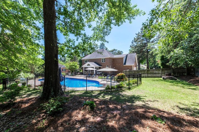 view of pool with a fenced in pool, a fenced backyard, a patio area, and a yard