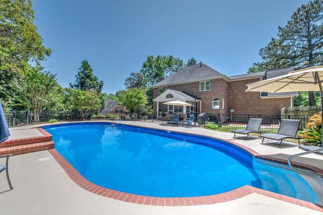 view of pool featuring a fenced in pool, a patio area, and fence