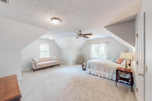 bedroom featuring carpet flooring, visible vents, and lofted ceiling
