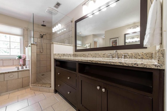 full bath with a walk in shower, vanity, tile patterned floors, visible vents, and a bath