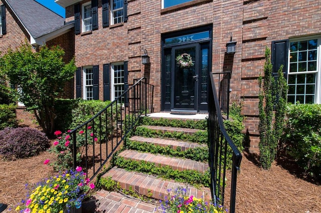 entrance to property with brick siding