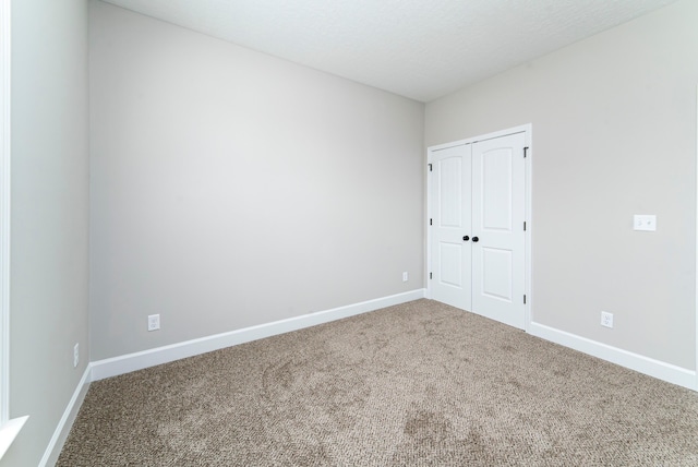 645 Jet Pass, Beech Island, SC 29842 - unfurnished bedroom with carpet flooring, baseboards, and a closet