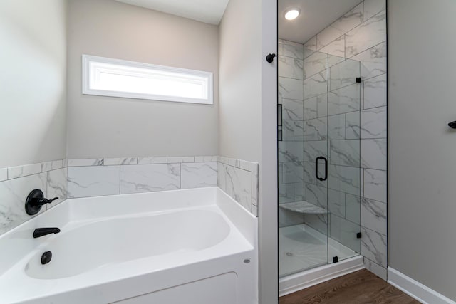 645 Jet Pass, Beech Island, SC 29842 - bathroom featuring a stall shower, a bath, and wood finished floors