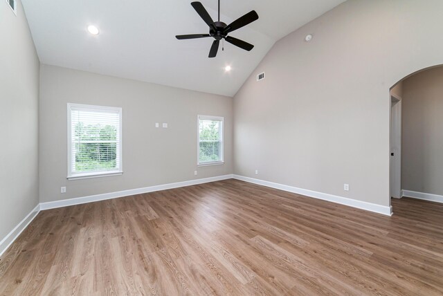 645 Jet Pass, Beech Island, SC 29842 - empty room with arched walkways, a ceiling fan, high vaulted ceiling, wood finished floors, and baseboards