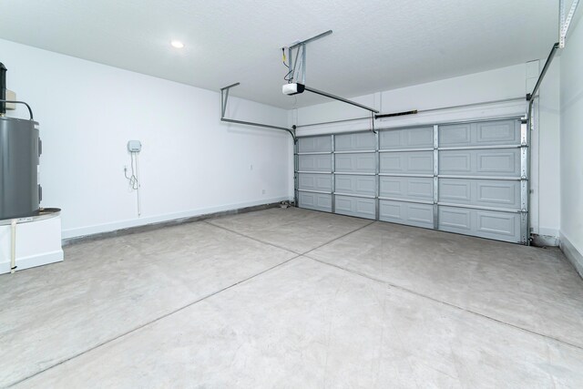 645 Jet Pass, Beech Island, SC 29842 - garage featuring electric water heater, a garage door opener, and baseboards