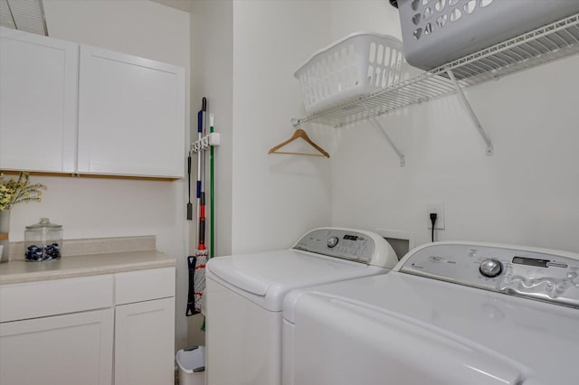 laundry area with cabinets and washer and dryer