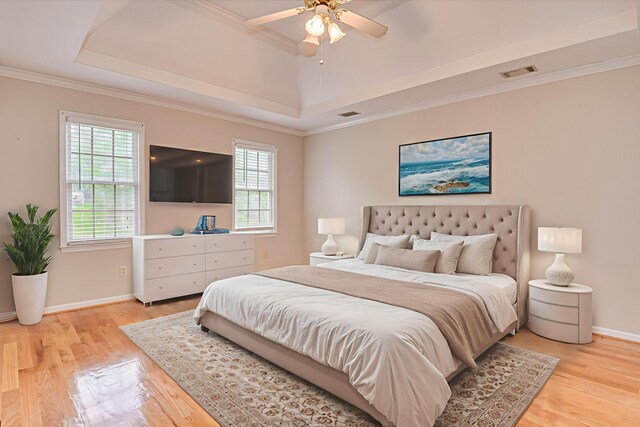 3696 El Cordero Ranch Springs Rd, Augusta, GA 30907 - bedroom with a tray ceiling, multiple windows, wood finished floors, and crown molding