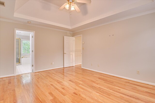 3696 El Cordero Ranch Springs Rd, Augusta, GA 30907 - unfurnished room featuring a tray ceiling, light wood-style flooring, a ceiling fan, baseboards, and crown molding