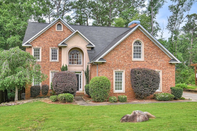 3696 El Cordero Ranch Springs Rd, Augusta, GA 30907 - traditional-style house with a front lawn, brick siding, and a shingled roof
