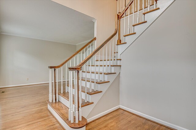 3696 El Cordero Ranch Springs Rd, Augusta, GA 30907 - staircase with wood finished floors, baseboards, and ornamental molding