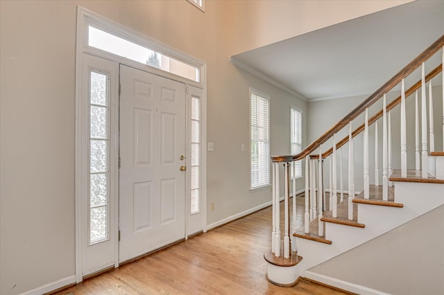 3696 El Cordero Ranch Springs Rd, Augusta, GA 30907 - foyer featuring ornamental molding, stairs, wood finished floors, and baseboards