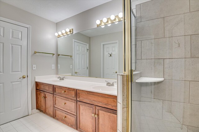 3696 El Cordero Ranch Springs Rd, Augusta, GA 30907 - full bathroom with double vanity, tile patterned flooring, and a shower stall