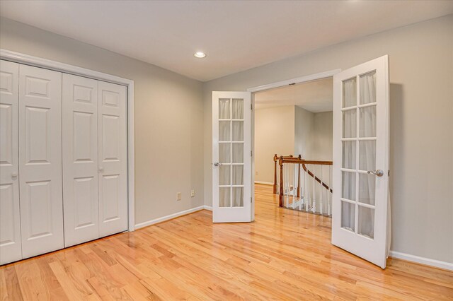 3696 El Cordero Ranch Springs Rd, Augusta, GA 30907 - unfurnished bedroom featuring french doors, wood finished floors, baseboards, recessed lighting, and a closet